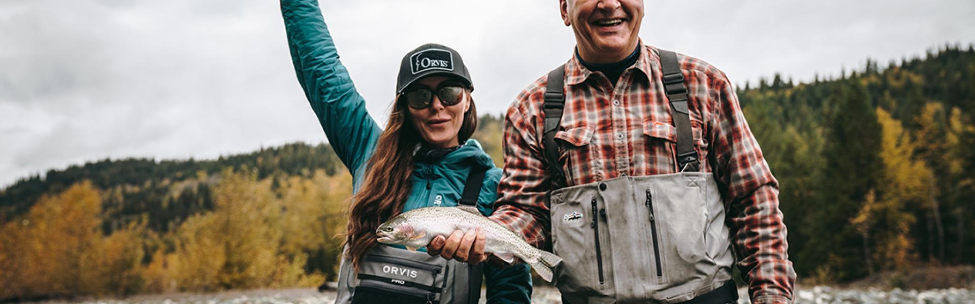 Guide, Doug Mooring and fisherwoman holding a fish in excitement